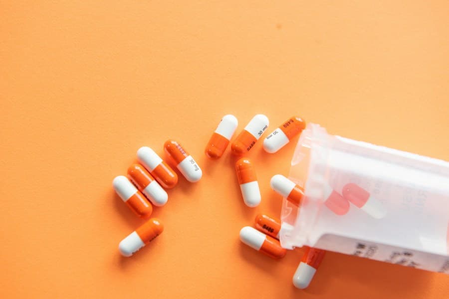 Medicine capsules spilling from a bottle